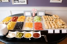 a buffet table filled with different types of food