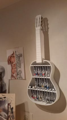 an electric guitar hanging on the wall