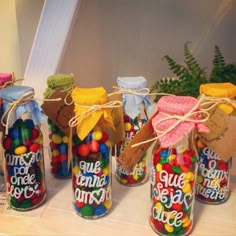 several jars with candy and candies in them