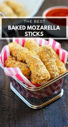 some fried food is in a basket on a table with sauces and dipping sauce