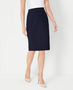 Elevate your professional wardrobe with the Ann Taylor Petite Seamed Pencil Skirt in Seasonless Stretch. This skirt is meticulously crafted to provide a streamlined, tailored fit that flatters and enhances your silhouette. The deep navy sky color adds a touch of sophistication to any outfit, making it a versatile choice for various occasions.

- Size: Petite 00
- Color: Deep Navy Sky
- Gender: Female
- Material: Shell - 68% Polyester, 29% Viscose, 3% Spandex; Lining - 100% Polyester
- Length: 22 Knitted Suit, Stretch Pencil Skirt, Professional Wardrobe, Work Tops, Midi Maxi Dress, Chic Woman, Evening Wear, Modern Woman, Simple Style