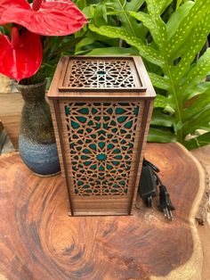 a wooden table topped with a vase filled with flowers