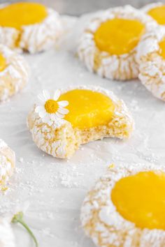 powdered sugar cookies with yellow and white toppings