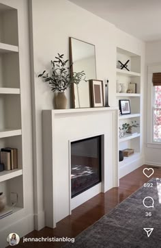 a living room filled with furniture and a fire place in front of a white fireplace