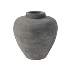 a large gray vase sitting on top of a white surface