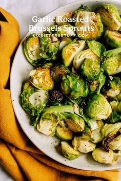 brussel sprouts in a white bowl on a yellow napkin