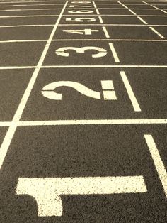 a red running track with white markings on it