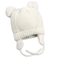 a white knitted hat with pom - poms