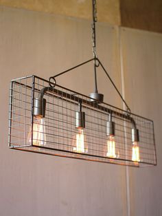 a light fixture with five bulbs hanging from it