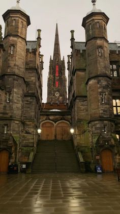 an old castle with stairs leading up to it