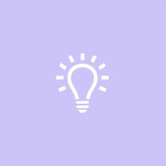 a white light bulb on a purple background