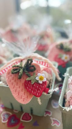 there are many small baskets with strawberries in them