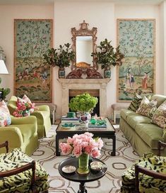 a living room filled with lots of green furniture