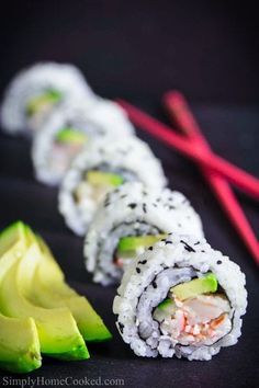 sushi with shrimp and avocado on it