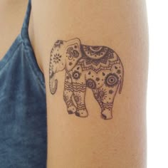 an elephant tattoo is shown on the arm