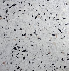 a white and black speckled surface is shown