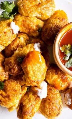 fried food on a plate with dipping sauce