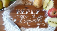 some apples, pears and other fruits on a table with the words ready to consume written in flour