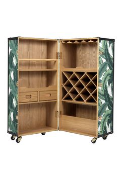 an open wooden wine rack with tropical print on the front and side panels, sitting on wheels