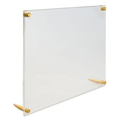 a white board with two gold handles on the bottom and one in the middle, against a white background