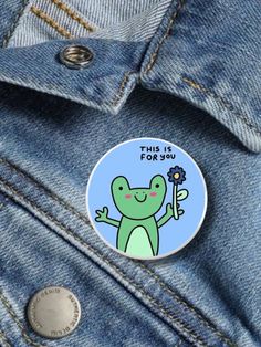 a green frog with a flower in its hand and the words this is for you on it