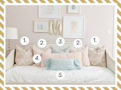 a white daybed with lots of pillows and numbers on it