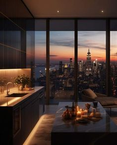 a living room filled with furniture and a large window overlooking the city at night time