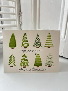 a card with christmas trees on it