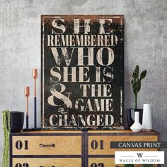 a wooden sign that says she is the one who she's and the game changed