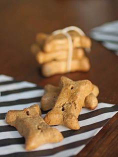 some cookies are sitting on a table next to each other with teddy bears in the background