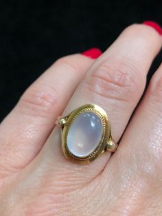 Retro era 14k gold and moonstone ring.  Moonstone is thought to promote emotional balance, and enhance calm, helping you to find inner peace and stability. Moonstone also encouraging and promotes joy while embarking on new beginnings. This ring is size 7.25 Luxury Antique Style Moonstone Ring, Luxury Vintage Oval Cabochon Moonstone Ring, Luxury Vintage Moonstone Ring As A Gift, Luxury Vintage Moonstone Ring For A Gift, Vintage Oval Cabochon Moonstone Jewelry, Heirloom Oval Cabochon Opal Ring, Vintage Yellow Gold Oval Moonstone Ring, Classic Gold Moonstone Ring With Oval Cabochon, Spiritual Yellow Gold Oval Opal Ring