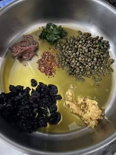 an assortment of ingredients in a metal bowl