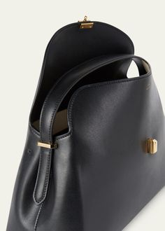 "Find TOTÊME T Lock Flap Leather Clutch Bag on Editorialist. Toteme clutch bag in leather Detachable, adjustable shoulder strap can be worn as a clutch or shoulder bag Flap top with T lock closure Lining: Polyurethane Feet protect bottom of bag Approx. 6.7\"H x 13.7\"W x 4.5\"D Made in Italy" Abstract Fashion, Leather Clutch Bag, Shoulder Strap Bag, Leather Clutch Bags, Black Tote Bag, Leather Slip Ons, White Bag, Leather Tote Bag