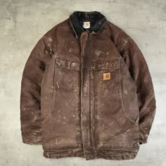 Circa 1990's carhartt' s original range consisted of a limited selection of rigid signature fabrics; its cuts were large and square.  these garments were authentic workwear, designed for just that: to work outdoors. iconic arctic coat in brown, corduroy collar. good vintage conditions some stains/signs of wear, common on these kind of vintage pieces. no size tag - fit xl/xxl - check measurements pit to pit 70 cm sleeve length 63 cm back length 81 cm Mens Carhartt Jacket, Carhartt Coat, Collarless Coat, Carhartt Vintage, Carhartt Workwear, Brown Corduroy, Vintage Carhartt, Outdoor Jacket