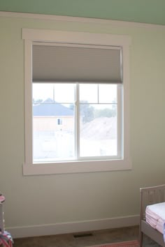 a bedroom with a bed and window in it