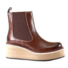 A real retro-inspired favorite, She Nah by Diba True has arrived on the scene. A sleek leather upper with slight antiquing on the toe bed meets sleek gore panels that rest on a 2.5 inch stacked platform wedge with a padded insole for maximum comfort. Size: 6.  Color: Brown.  Gender: female.  Age Group: adult. Brown Leather High Heel Platform Boots, Brown High-top Wedge Boots With Platform, Brown Round Toe Wedge Boots For Spring, Spring Brown Wedge Boots With Round Toe, Spring Brown Round Toe Wedge Boots, Brown Wedge Boots With Leather Sole And Round Toe, Fall Leather Platform Wedge Boots, Leather Platform Ankle Wedge Boots, Leather Wedge Boots With Round Toe