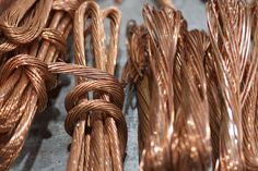 several coils of copper wire on a table