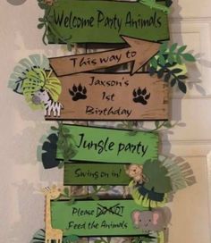 a sign that says welcome party animals and has jungle decorations on the top of it