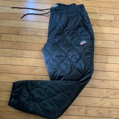 These Men’s Thermore Inslulated Nike Pants Are Brand New With Tags. Has A Quilted Style And Gathers Elastic Around The Bottom. Kept In A Smoke Free Environment And Free Of Pet Hair And Dust Size-Xl Nike Sweatpants For Winter Streetwear, Nike Casual Sweatpants For Outdoor, Nike Winter Streetwear Sweatpants, Nike Pants For Winter Streetwear, Nike Winter Streetwear Pants, Nike Sweatpants With Pockets For Winter, Nike Winter Sweatpants With Pockets, Nike Sportswear Pants For Outdoor Activities, Nike Black Winter Pants