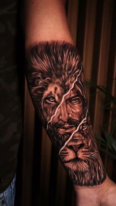 a man's arm with a lion tattoo on it and his face painted in black ink