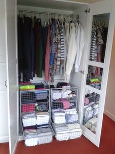 an organized closet with clothes and other items