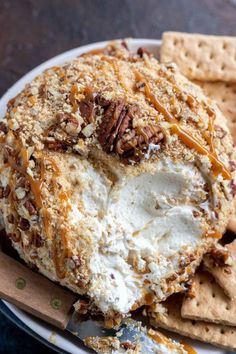 a white plate topped with ice cream and pecans