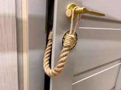 a door handle with a rope hanging from it