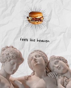 there is a sandwich and two statues on the side of the paper that says feels like heaven