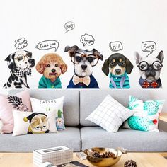 three dogs wearing glasses and bow ties sitting on a couch in front of a wall with speech bubbles