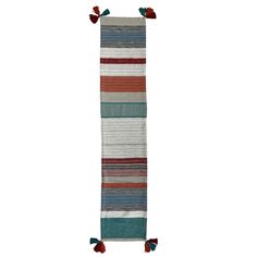 a multicolored striped rug with tassels hanging from the top and bottom