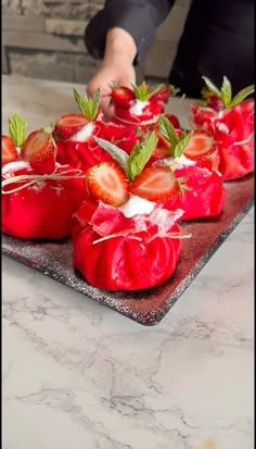 fresh strawberries are arranged on a platter ready to be eaten