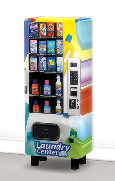 a vending machine with laundry products on it's display shelf in front of a white wall