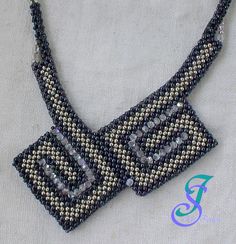 the beaded necklace is made with black and white beads