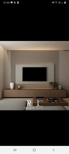 an image of a living room with a tv on the wall